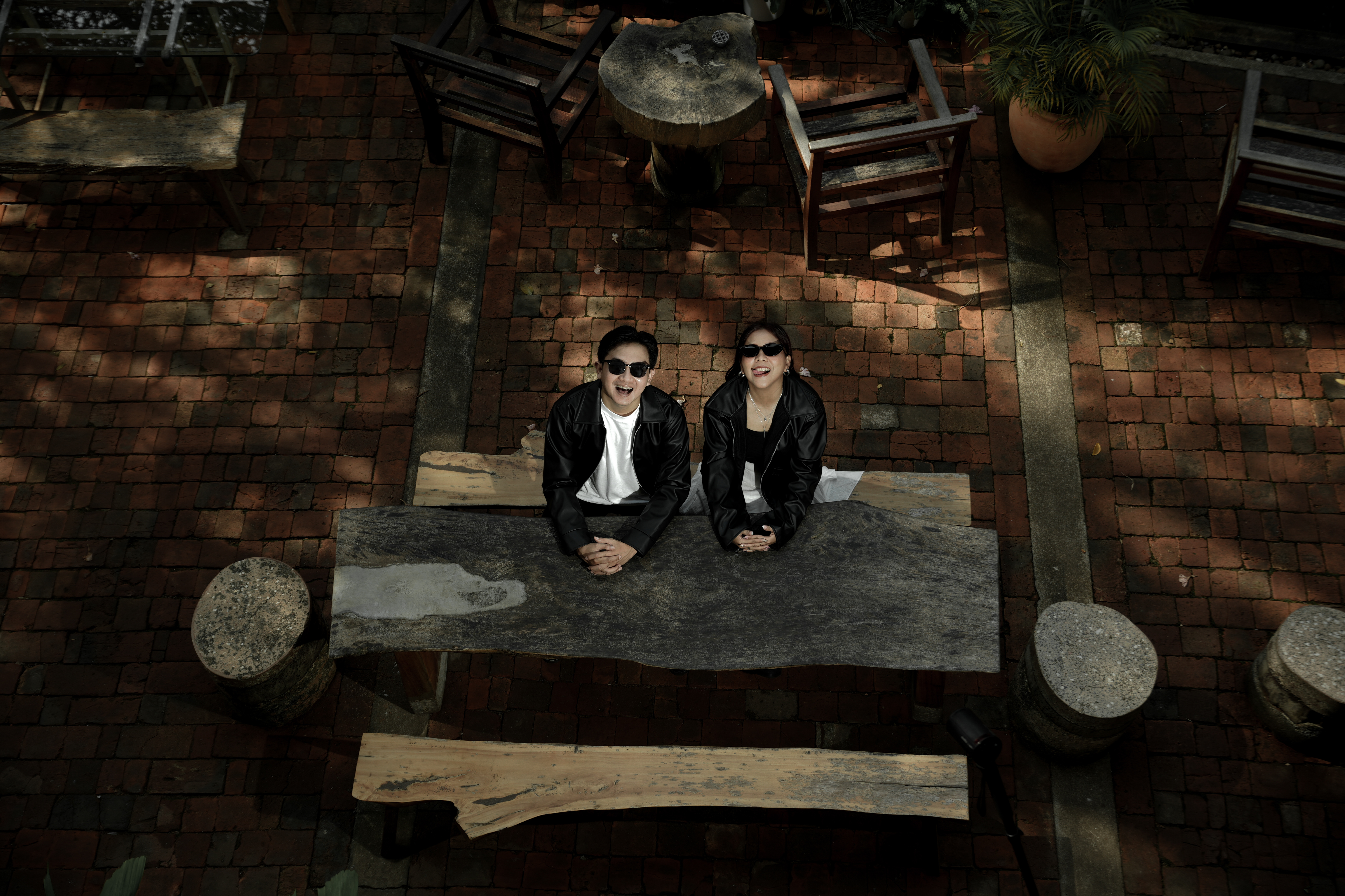 Ridho and Visi looking glamorous in sunglasses and wedding attire